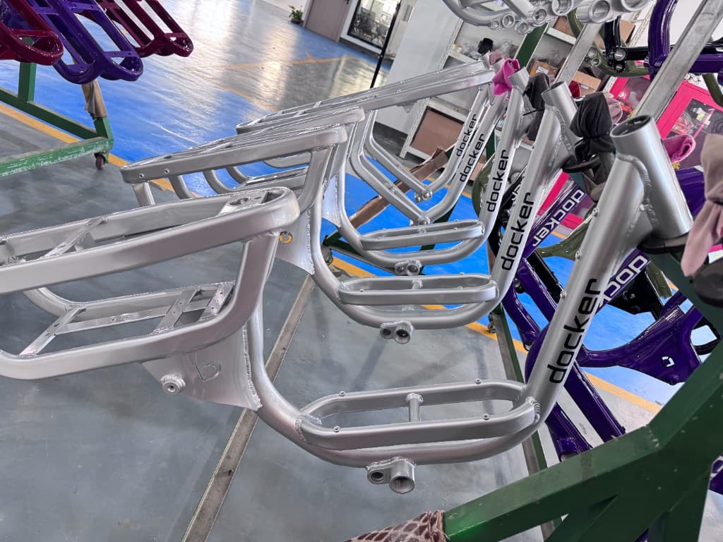 Brushed alloy Docker frames lined up in the factory