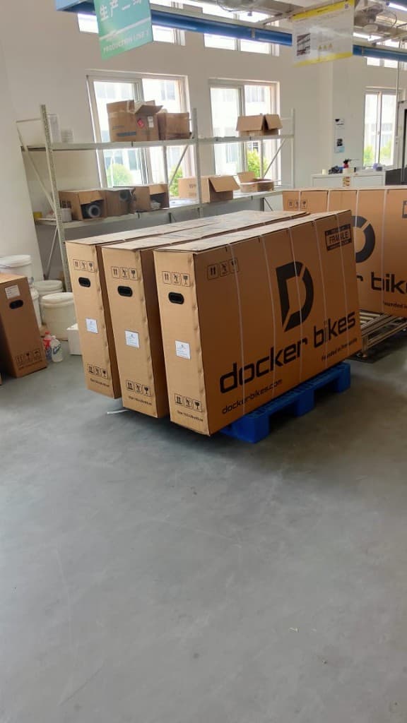 Docker Bikes cartons staged on a pallet for the container